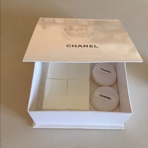 Chanel box -makeup applicators and 2 Chanel puffs.